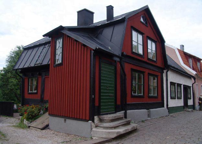 Dark Grey House Exterior Paired with Red-Brown Undertones